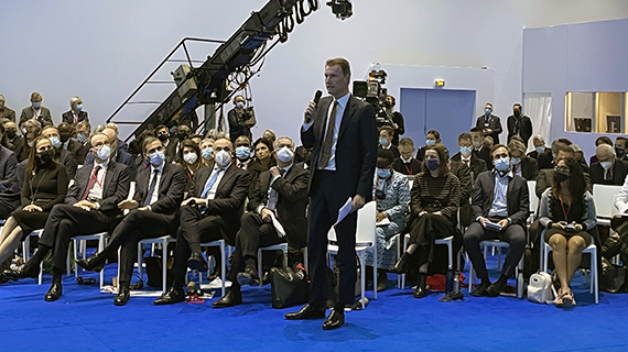 Soren Toft speaking at a conference from the audience place